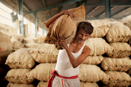 A FARMER CARRYING HIS PRODUCE 	