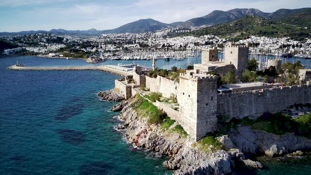 Amazing panoramic view from drone of beautiful full of yachts Bodrum harbour and ancient Kalesi castle in Mugla province in Turkey