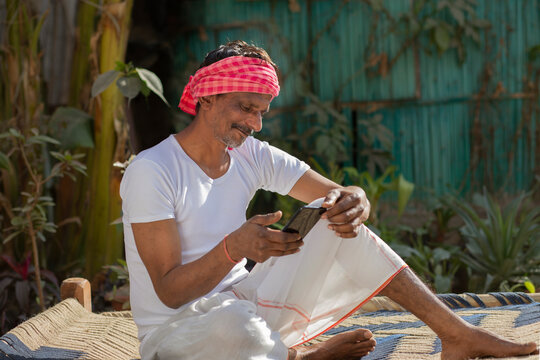 Indian Farmer Holding Mobile Phone	