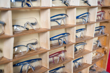 Fototapeta na wymiar many chemistry working protection glasses shell rowed up in a shool laboratory