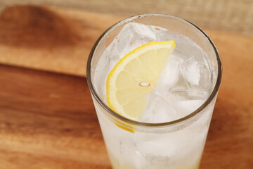lemonade in glass on wooden tray