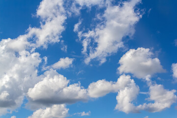 Naklejka na ściany i meble Beautiful summer blue sky with cumulus fluffy clouds background.