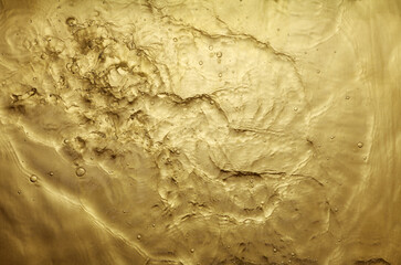 texture of splashing water on gold background