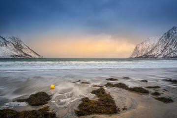 Obraz premium Gulf, bay, Sand beach with a huge surf in Ersfjord in sunrise