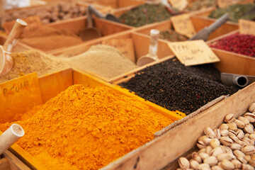 Spices are solding in outdoor market, Sicily, Italy. Curcuma in focus