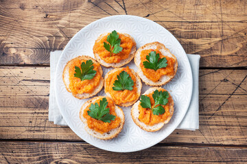 Sandwiches with bread zucchini caviar tomatoes onions. Homemade vegetarian food. Canned stewed vegetable. wooden background top view, copy space