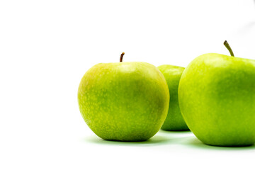 Delicious green apple on a white background