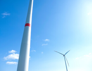 Windmill against blue sky in sunshine