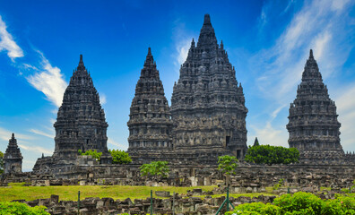 Fototapeta premium The view of Prambanan temple in Indonesia. Panoramic view at the Hindu temple Prambanan with colorful sky at Yogyakarta Java, Indonesia