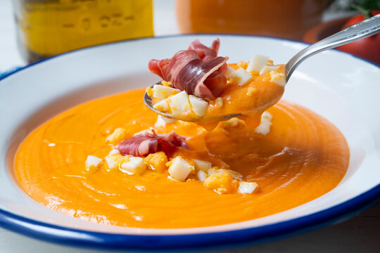 Salmorejo, typical cold tomato soup with iberico ham and boiled eeg and olive oil.