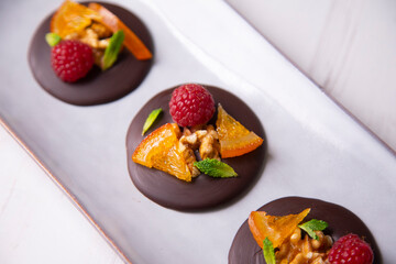 Músico chocolate with fruit and nuts.