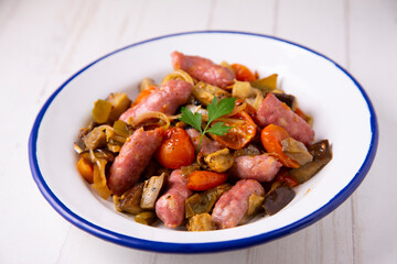 Pork salchichas with eggplant and paprika.