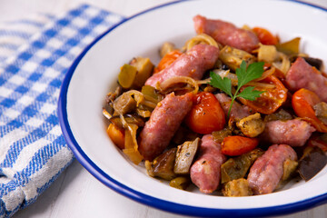 Pork salchichas with eggplant and paprika.