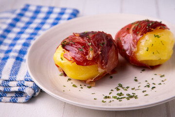 Potatoes with iberico ham in spain.