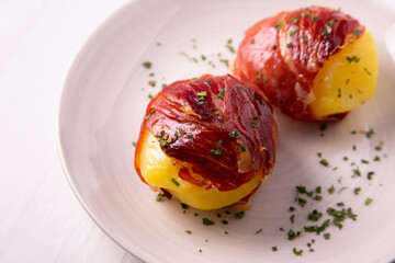 Potatoes with iberico ham in spain.