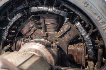 Detail of a large electric motor of a factory, you can see the coils and the rotor