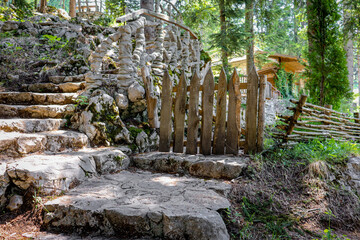 Fence in the forest made of  stone and wood