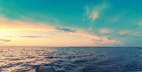 Panorama of seascape with beautiful sky in the evening. Sunset over the sea