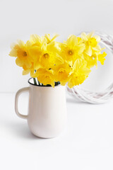 Happy Mothers Day greeting card with flowers. Bouquet of yellow daffodils on white background. Happy Easter template.