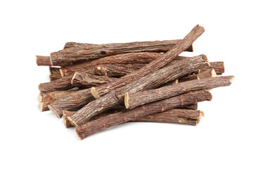 Dried sticks of liquorice root on white background