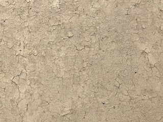 Fototapeta premium Texture of soil wall of home soil. Soil wall as a background or texture