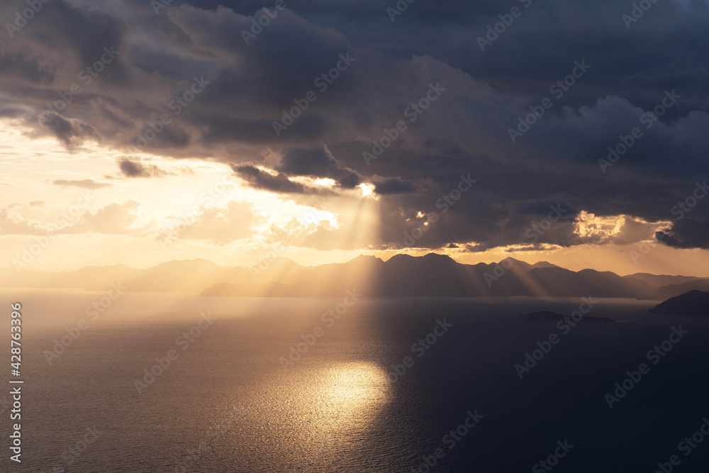 Wall mural beautiful sunset landscape over the sea coast in the clouds - Wall murals