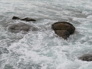 waves crashing on rocks