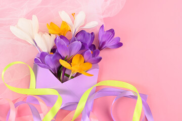 crocuses in an envelope with colored ribbons