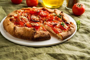 Galette with fresh tomatoes, herbs and cheese, open pie