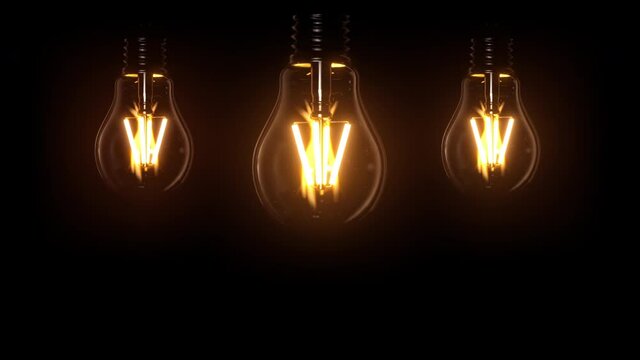 Switching on, turning off light bulbs animation. Yellow light over dark black background. Bright glowing and flickering Edison, Tungsten lamp. Retro vintage lamp shapes or form. 3D Render 4K animation