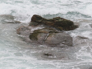 ocean waves crashing on rocks