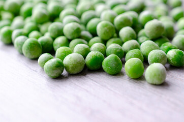 Fresh frozen peasground on grey background . with copy space