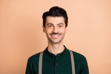 Obraz premium Photo of happy funky cheerful young man smile good mood wear suspenders isolated on beige color background