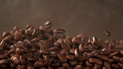 Falling roasted coffee beans