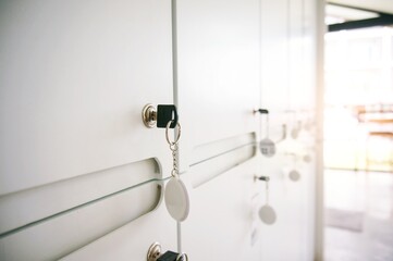 Key in keyhole on locker door. Keys stuck in a lock