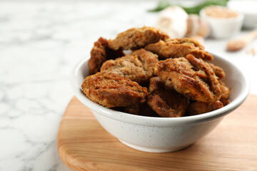 Delicious cooked soy meat on white marble table, closeup