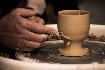 Fototapeta na wymiar hands of a potter at work