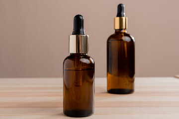Eco Mineral oil in Amber glass bottles with pipette. Transparent hyaluronic serum gel and skin care concept. Top horizontal view copyspace of dropper glass.