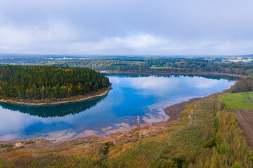 Fototapeta na wymiar Drones panorama over the autumnal hammer lake in the bavarian forest like in little canada