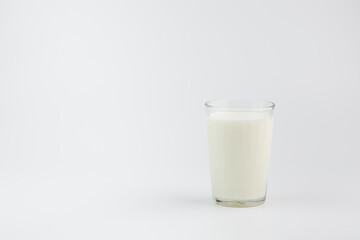 A glass of milk on a white background