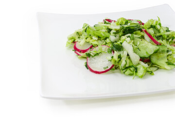 Spring salad of sliced fresh green vegetables and red radish