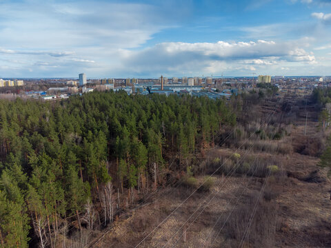 Aerial View Of Overhead Power Lines Over A Forest Clearing