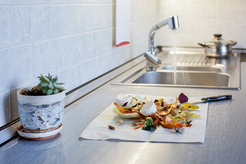 Food waste on kitchen table. Selective focus. Copy space.