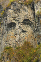 Old mountain with naturally emerged face