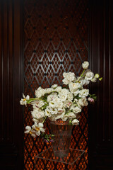 white lush bouquet on a dark background. wedding decorations