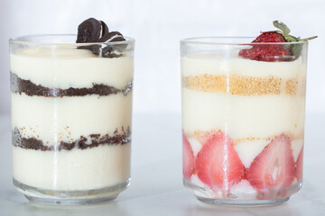 jar of strawberry and oreo pudding magnolia desert over white backdrop