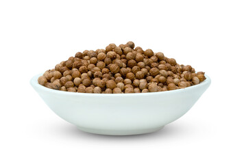 dried coriander seeds in ceramic bowl isolated on white background ,include clipping path