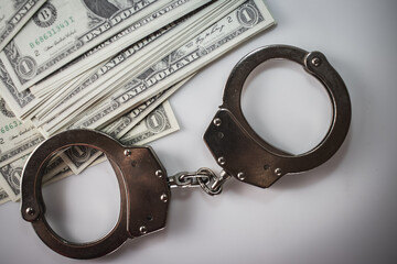 Handcuff above usa dollar. Theft, background