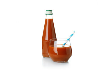 Glass and bottle of carrot juice isolated on white background