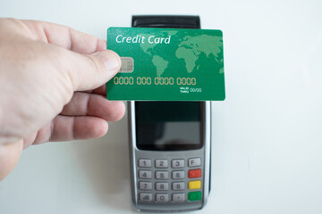 Credit Card And Pos Terminal On White. High quality photo